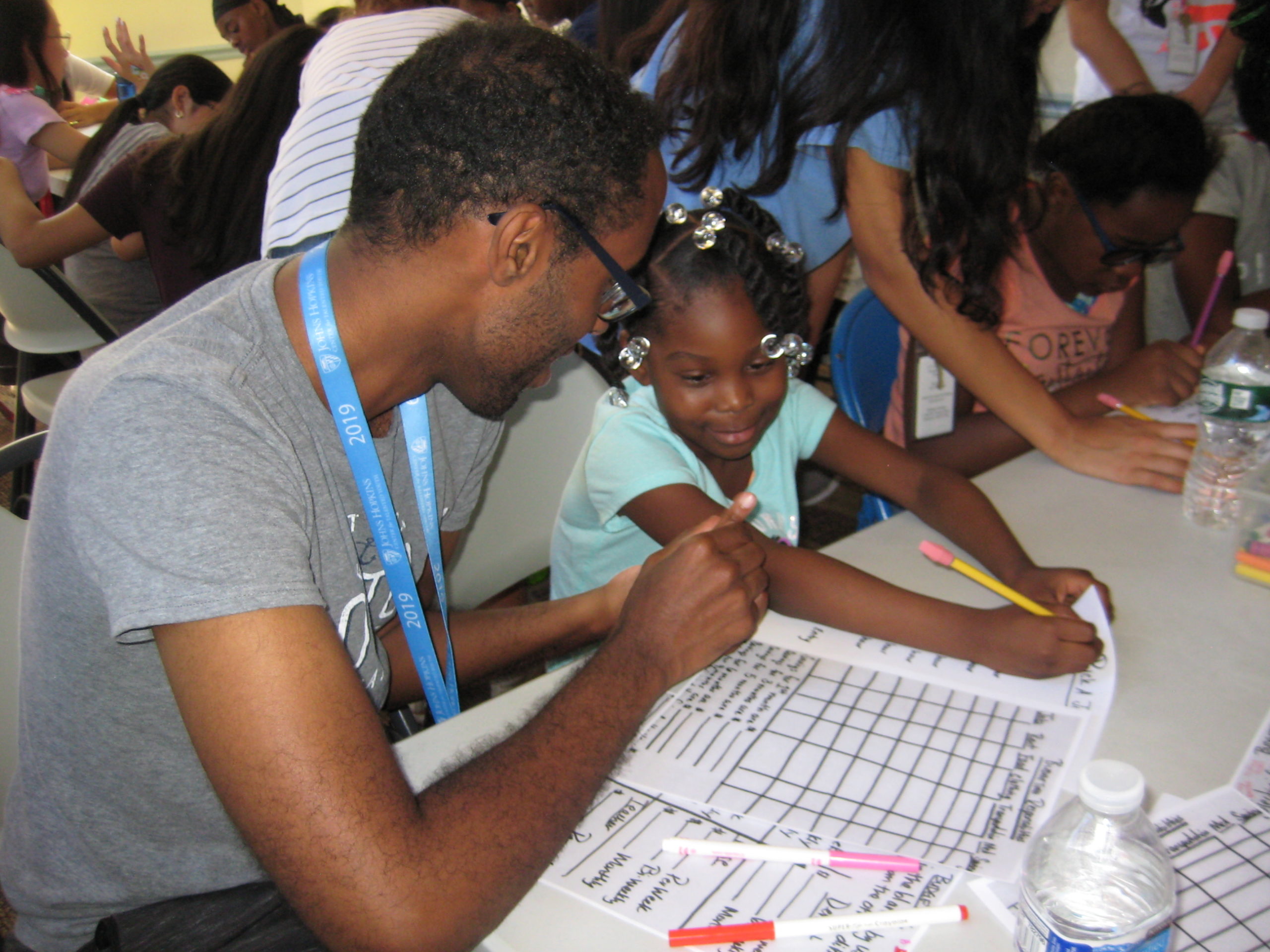 Volunteer Helping Young Girl 01
